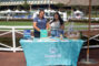 two women standing behind a table with a light blue table cloth and the Foothill Credit Union logo on it