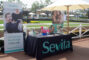 a table set with a black cloth reading Sevita beside a pop up banner