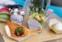 a tasting looking chip with salsa set beside a small cup of salad from Melange at the Le Meridien Hotel