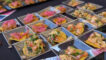 silver plates of ceviche on chips set out in rows