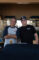 two men wearing shirts with the Overtown logo on them smiling and leaning towards each other