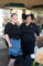 two women in black clothing posing and smiling