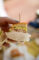 a yummy looking sandwich in a paper wrapper