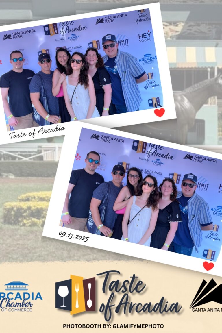 a large group of men and women in a photo booth setting with a background showing the Taste of Arcadia logo