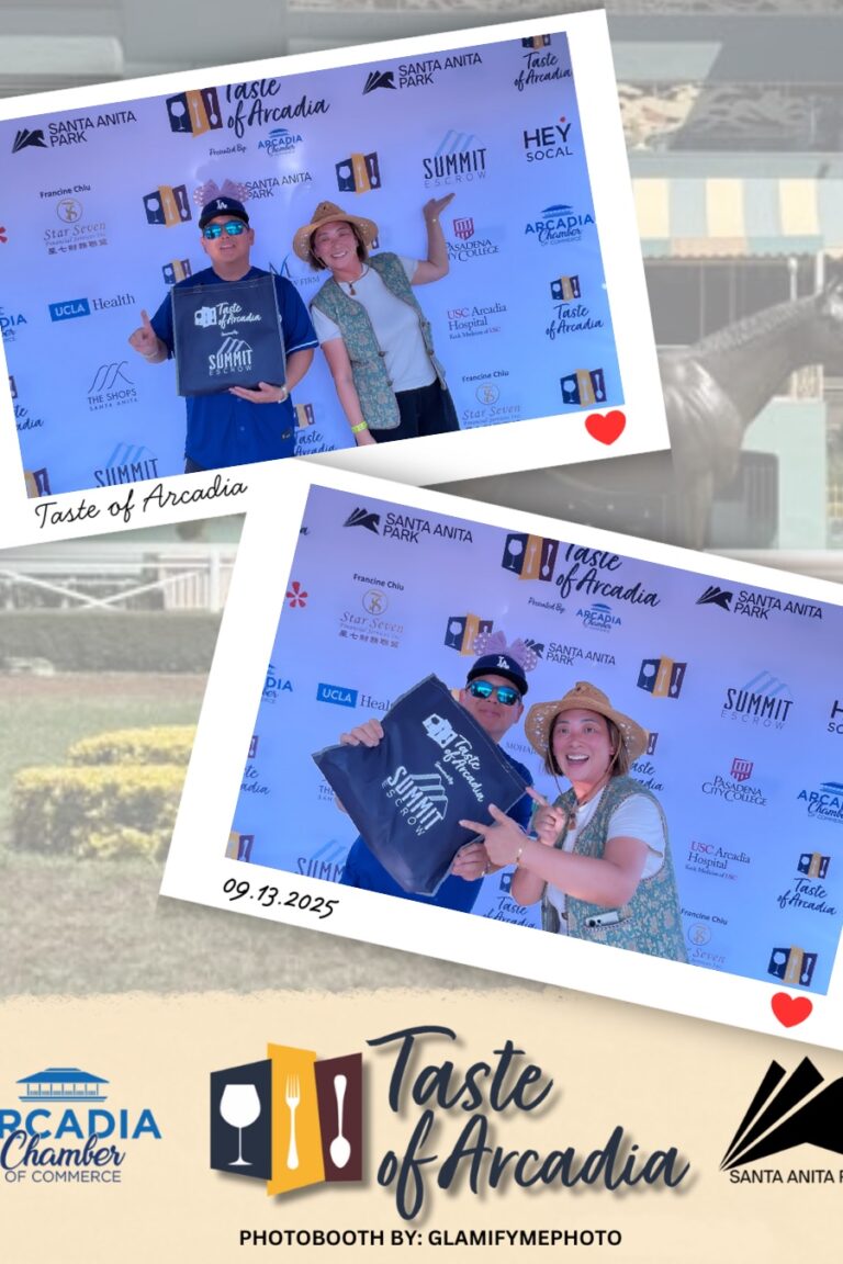 a woman in a green vest wearing a hat with a man holding a Taste of Arcadia gift bag in a photo booth setting with a background showing the Taste of Arcadia logo