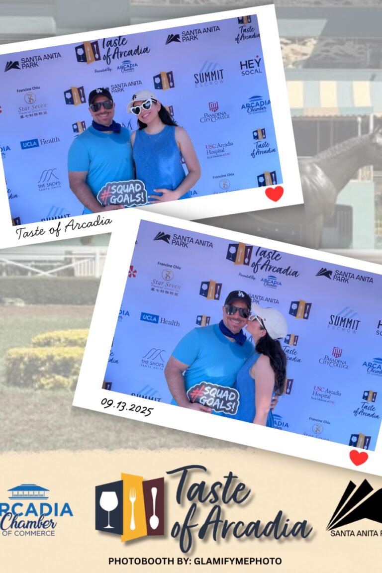 a man and woman both wearing bue shirts in a photo booth setting with a background showing the Taste of Arcadia logo holding a sign saying Squad Goals