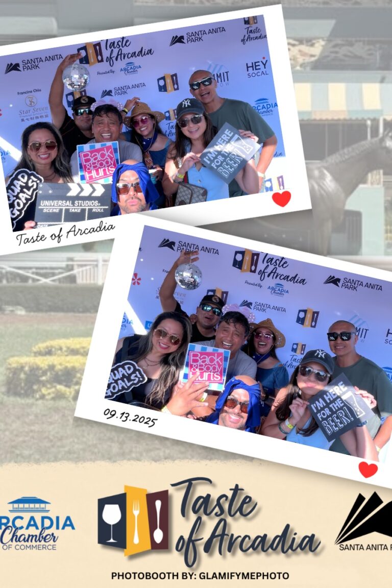 a large group of people holding signs in a photo booth on a background with the Taste of Arcadia logo