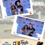 two women in hats in a photo booth on a background with the Taste of Arcadia logo