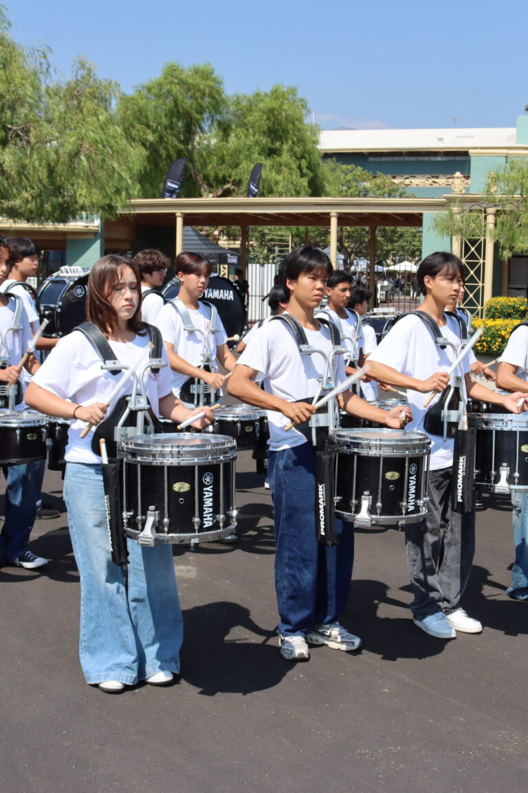 Arcadia High School Marching Drum Line playing in front of Santa Anita Park