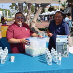 two men from the Upper San Gabriel Water District in their booth