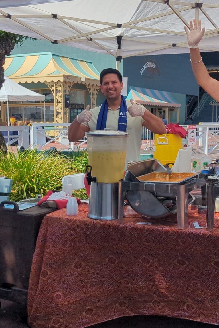 two men at a booth for All India Cafe at Taste of Arcadia