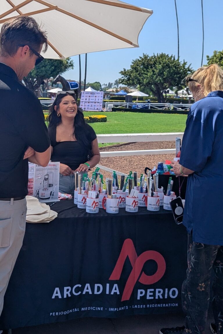 people visiting a booth for Arcadiaperio at Taste of Arcadia
