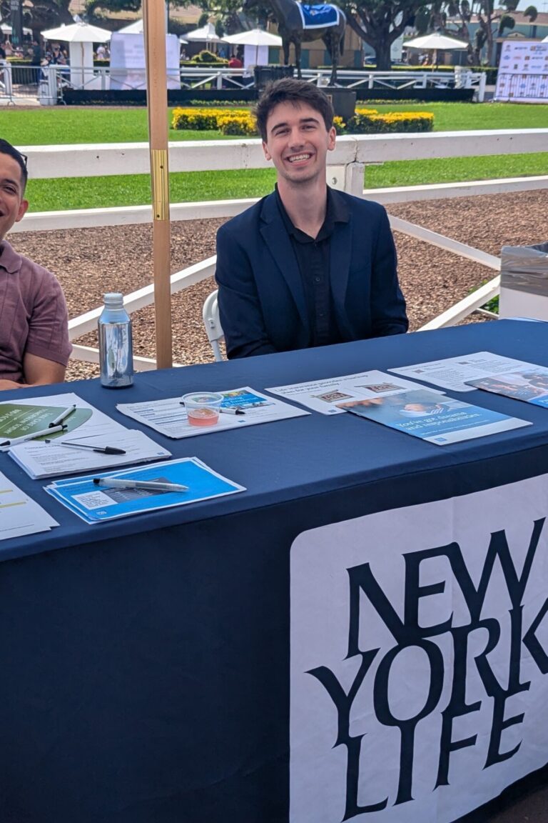 two men at a booth for New York Life at Taste of Arcadia