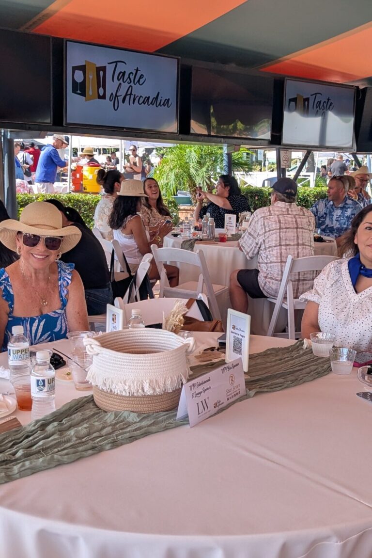a large group of people at a VIP Table at Taste of Arcadia