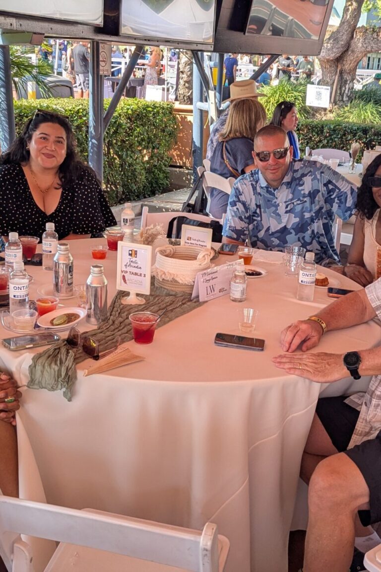 a large group of people at a VIP Table at Taste of Arcadia