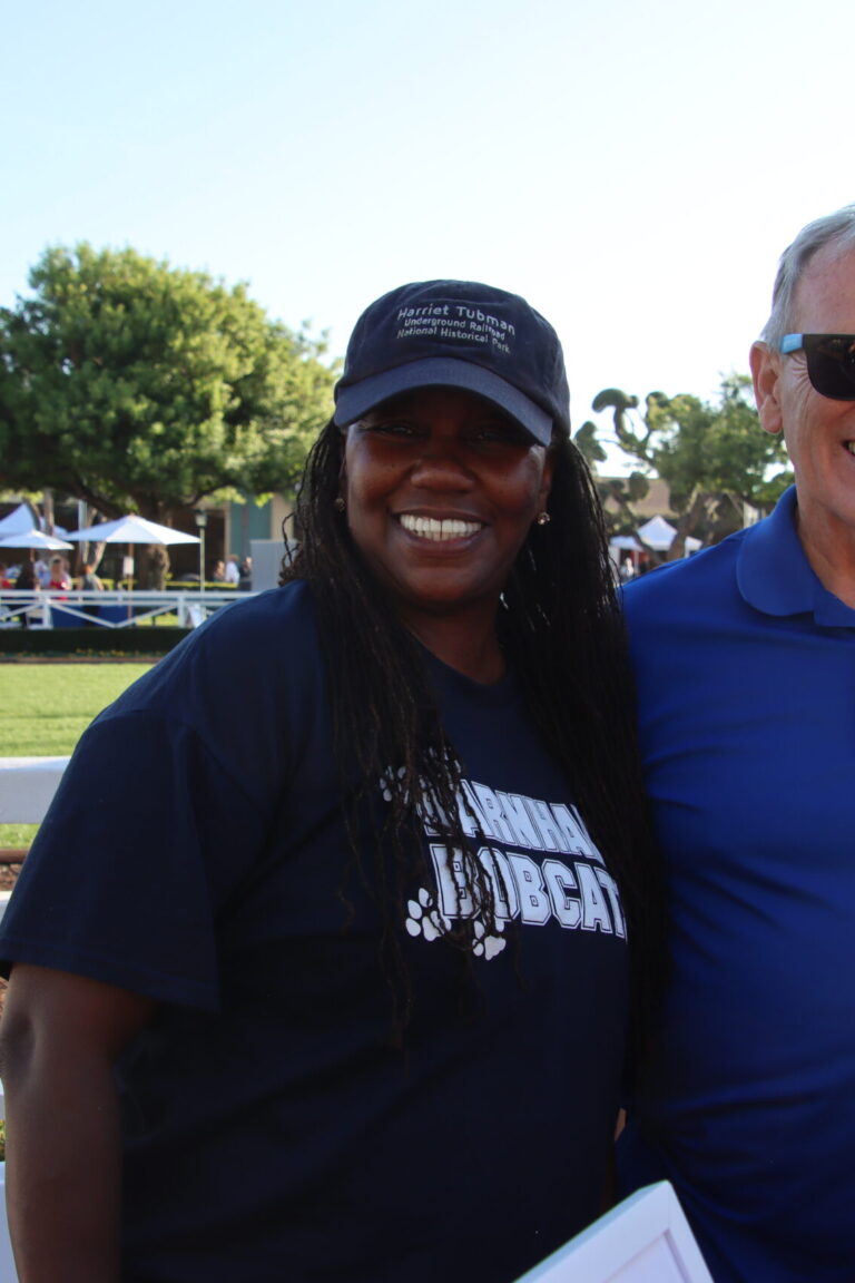 a woman and a man wearing Barnhart School shirts at Taste of Arcadia