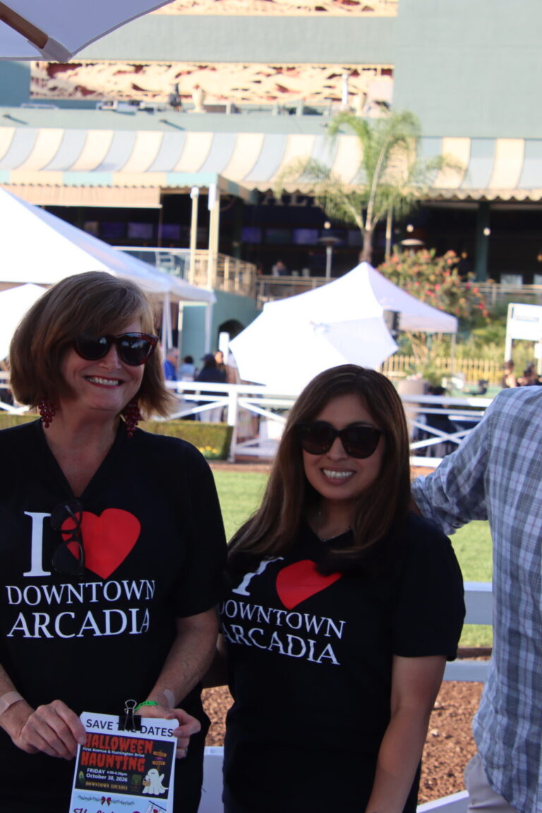 two women and two men at the Downtown Arcadia booth at Taste of Arcadia