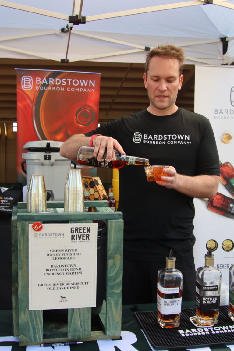 a man pouring a cocktail at a booth for Bardstown at Taste of Arcadia