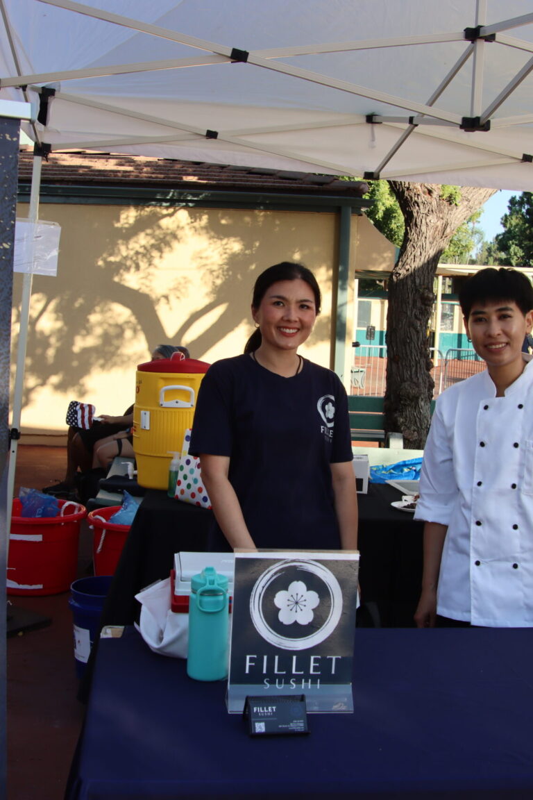 two women and a man behind a booth for Fillet Sushi at Taste of Arcadia